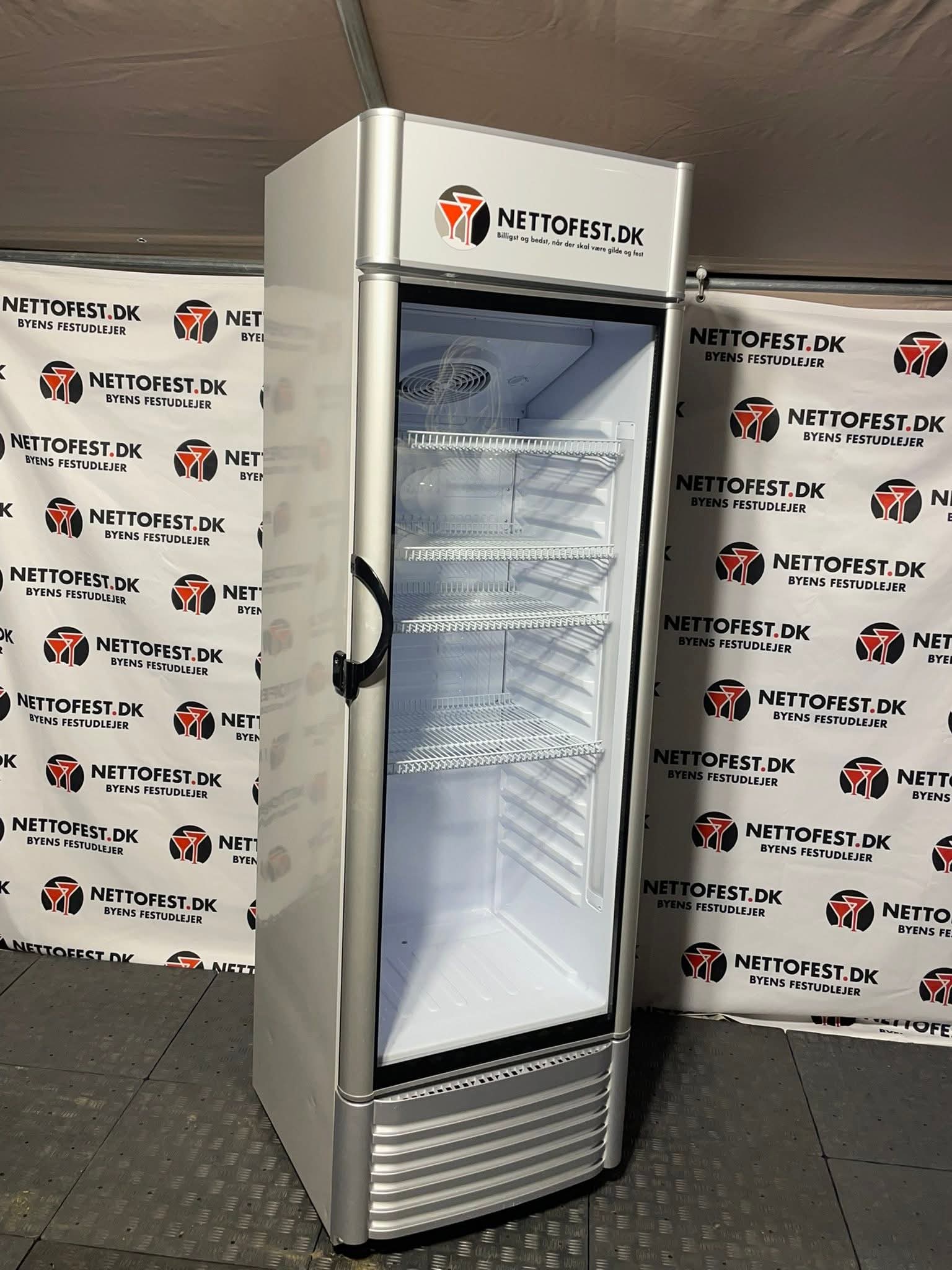 Eight shirts arranged on table in black, olive, grey, blue, white, red, mustard, and green.