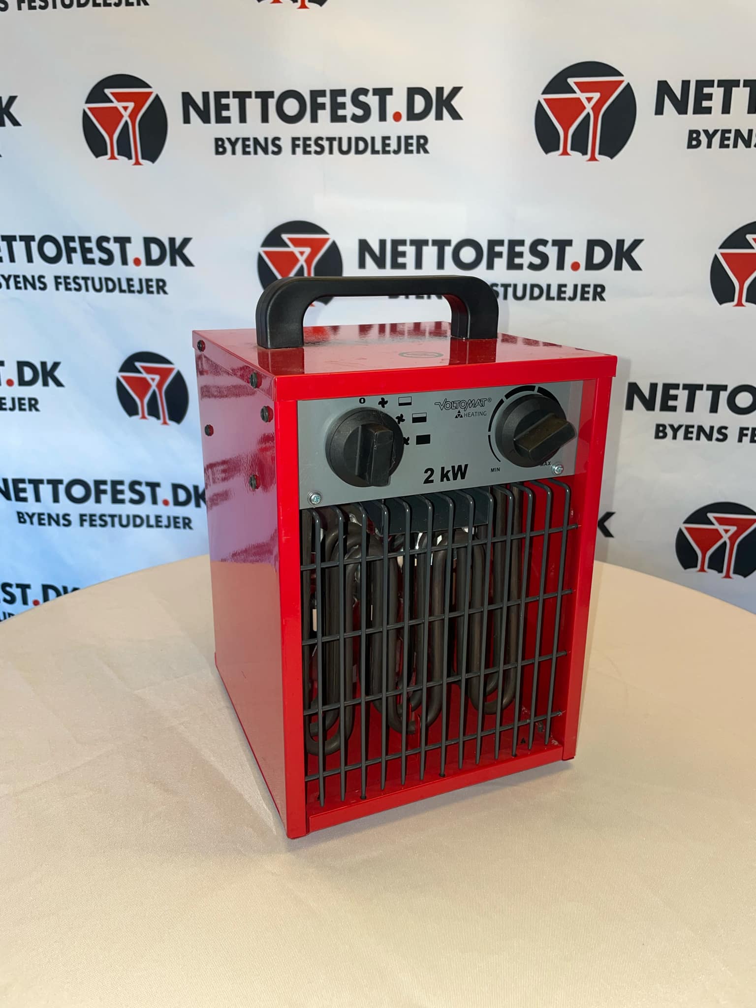 Eight shirts arranged on table in black, olive, grey, blue, white, red, mustard, and green.