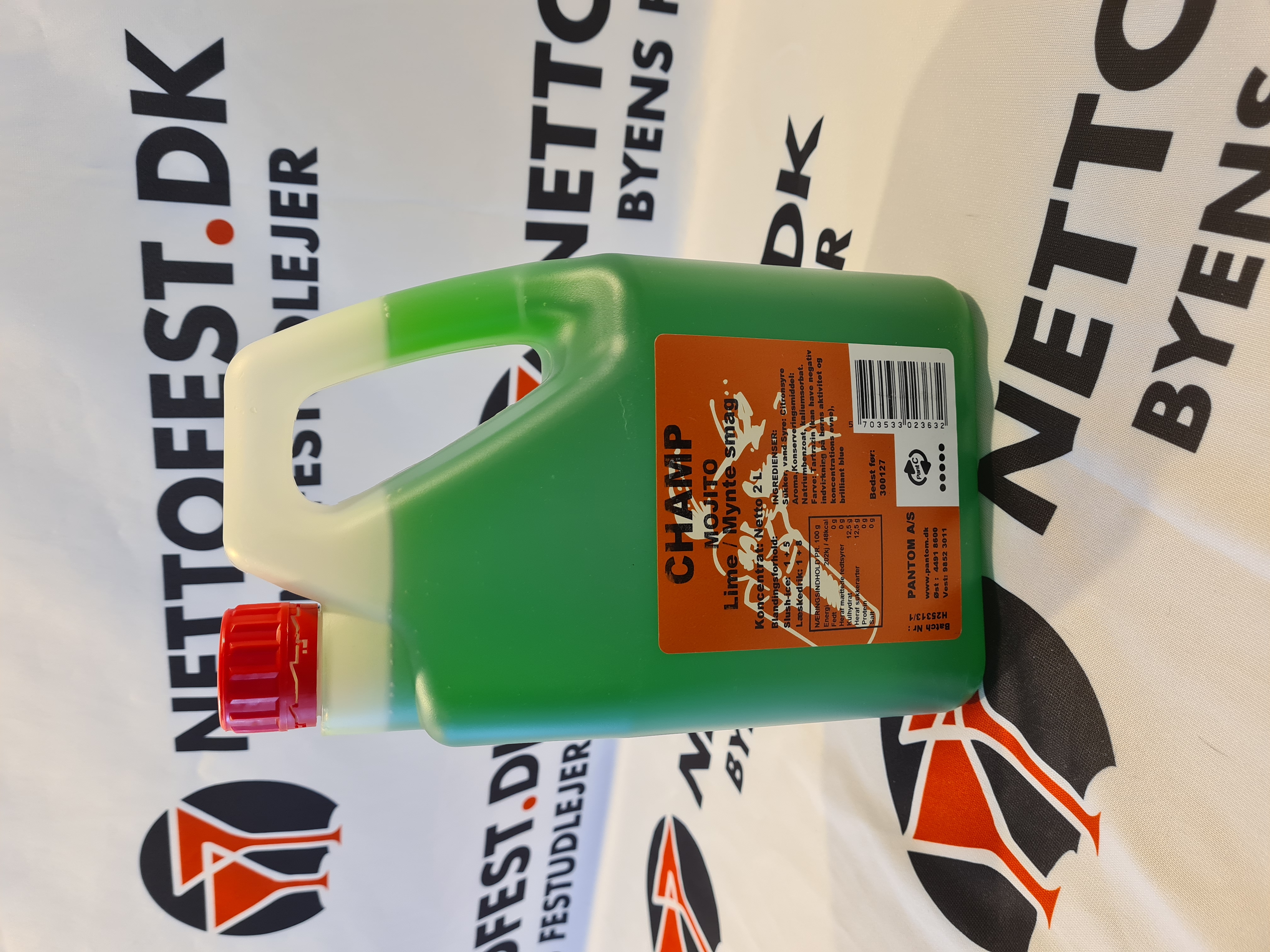 Eight shirts arranged on table in black, olive, grey, blue, white, red, mustard, and green.