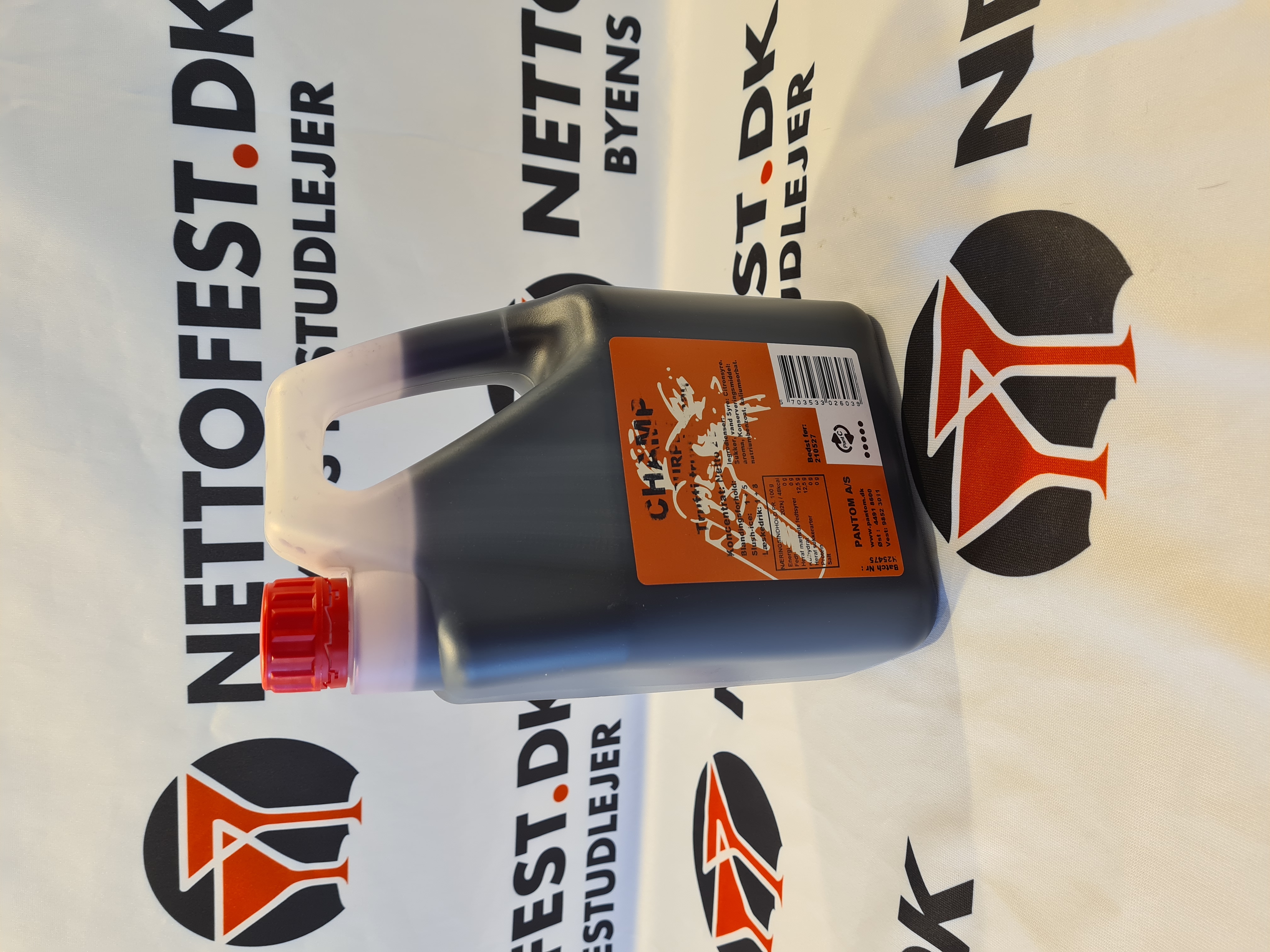 Eight shirts arranged on table in black, olive, grey, blue, white, red, mustard, and green.