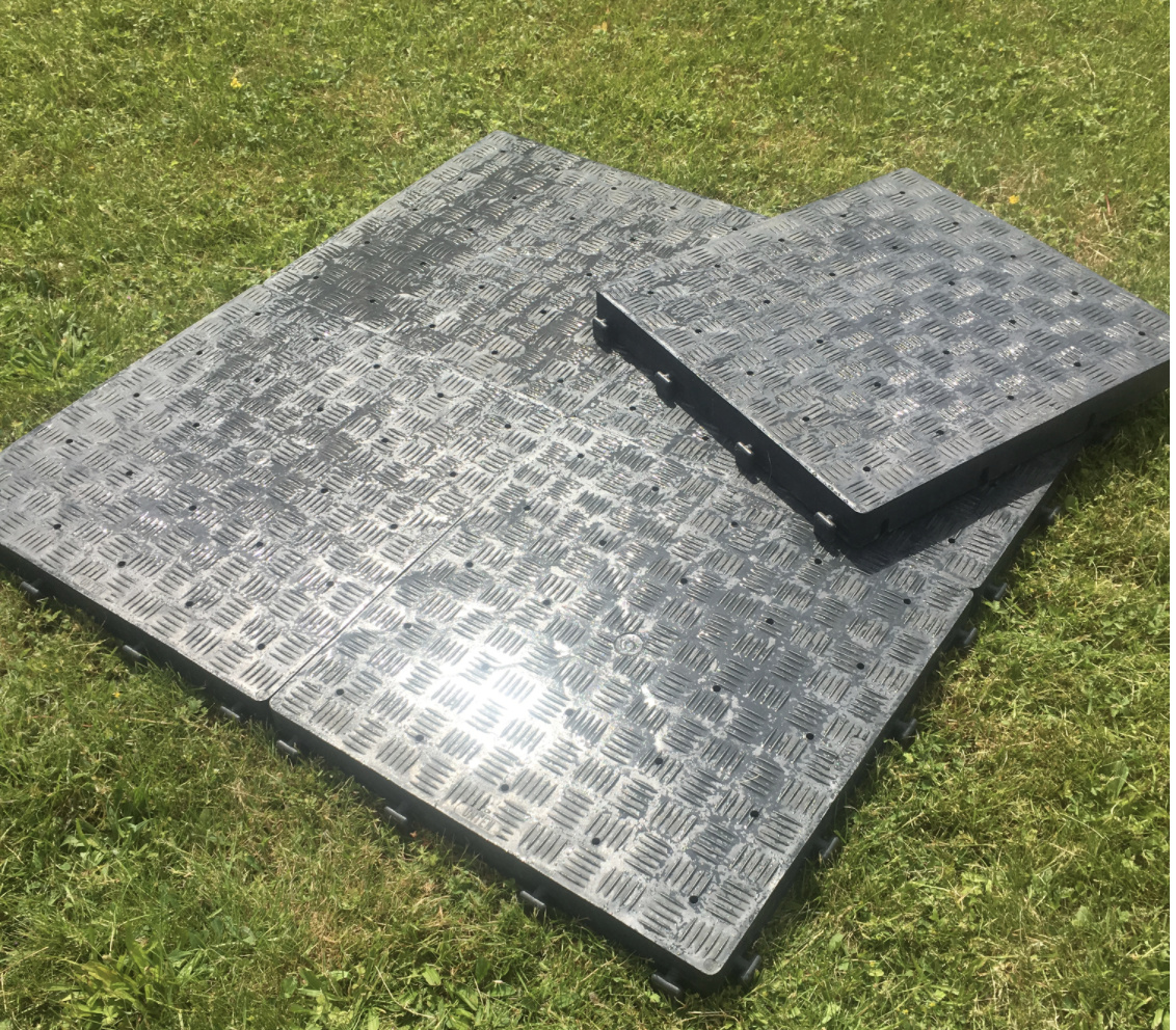 Eight shirts arranged on table in black, olive, grey, blue, white, red, mustard, and green.