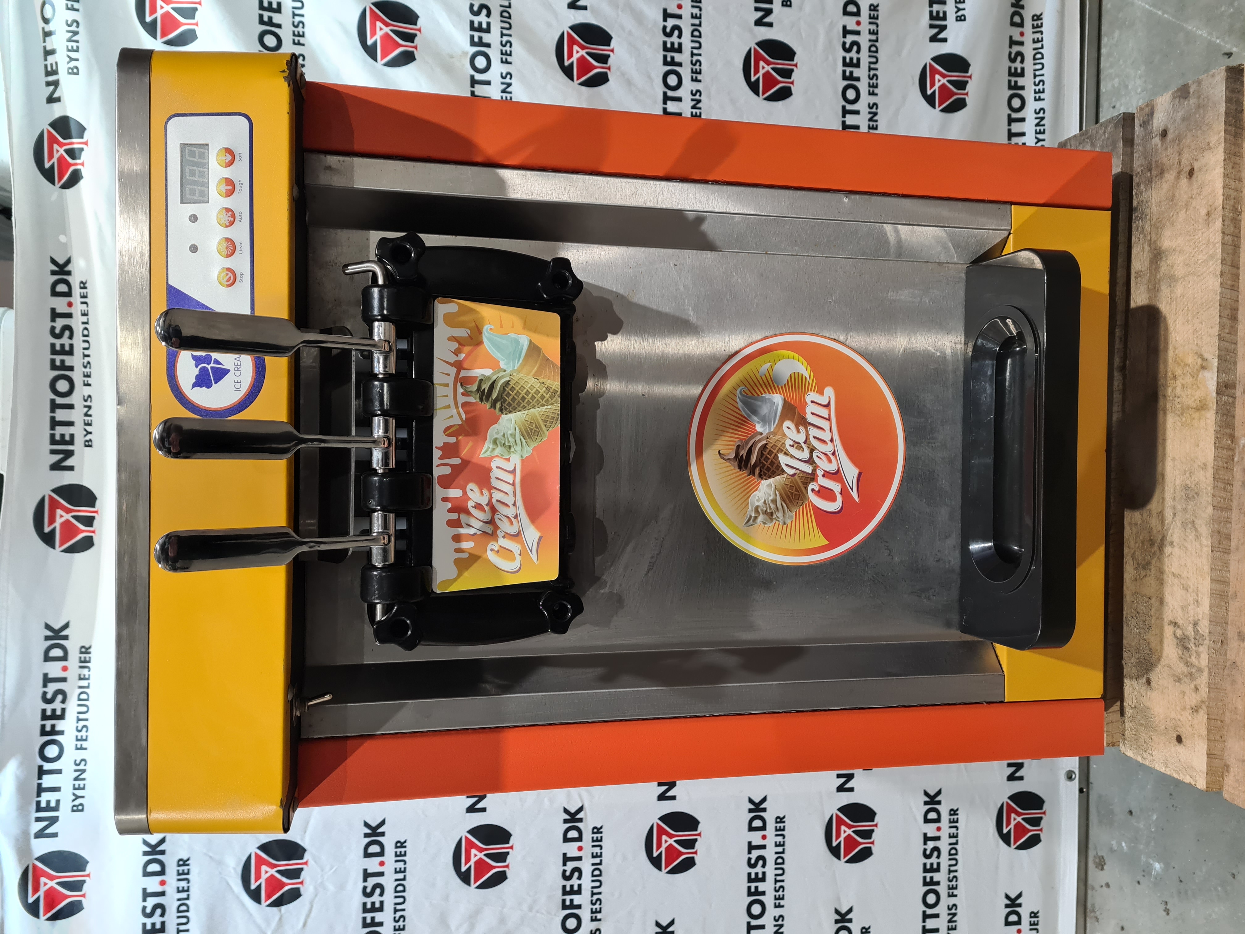 Eight shirts arranged on table in black, olive, grey, blue, white, red, mustard, and green.